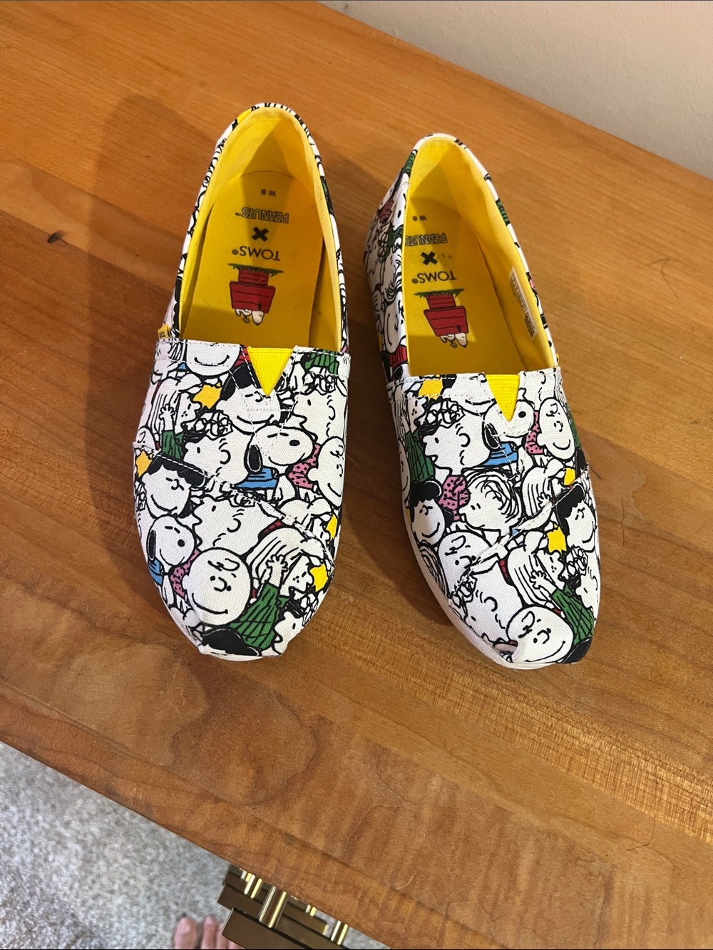 Toms Peanuts Print Slip-On Sneakers in White and Yellow